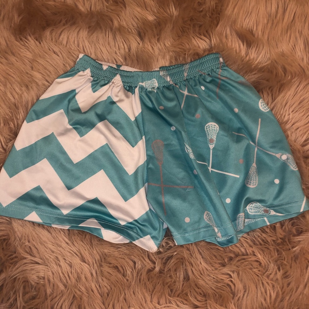teal and white chevron and lacrosse stick shorts